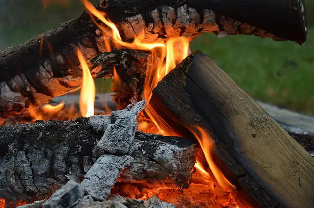 How far should a campfire be from a tent?